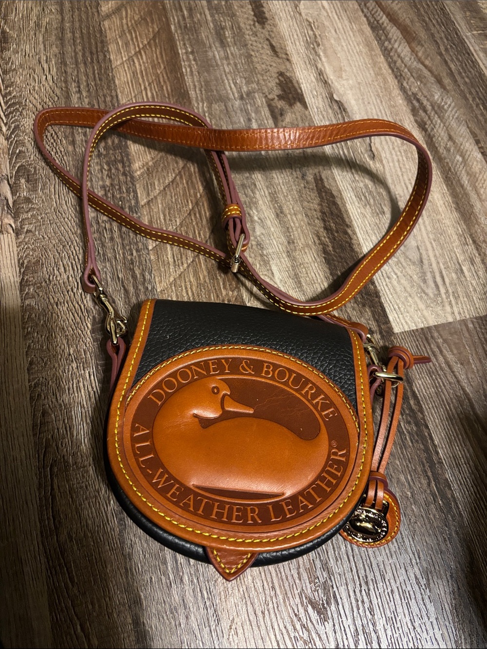 Dooney & Bourke Black and Brown Leather Saddle Crossbody